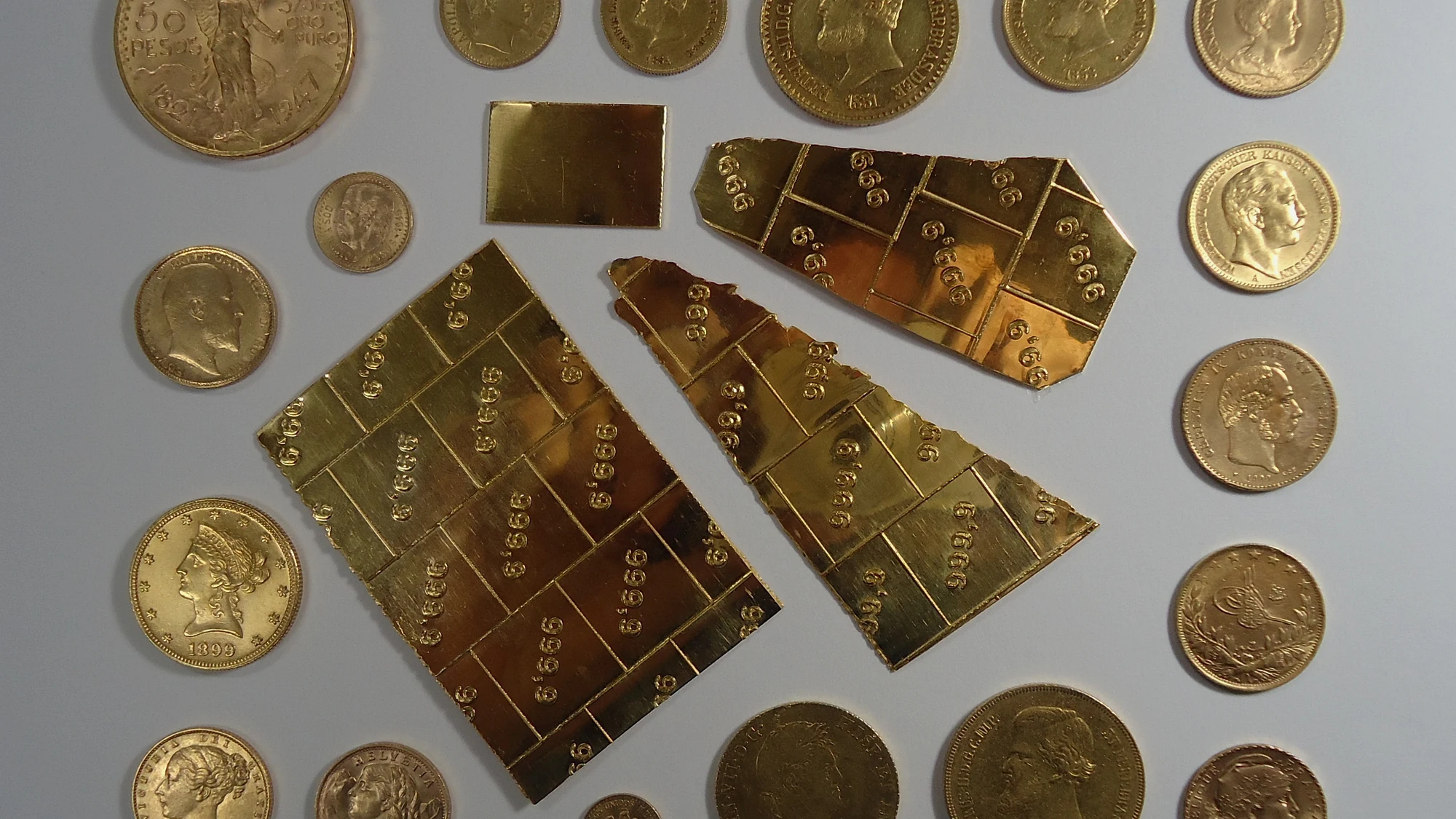 Gold sovereign coins used as a visual reference for purity and recoverable value